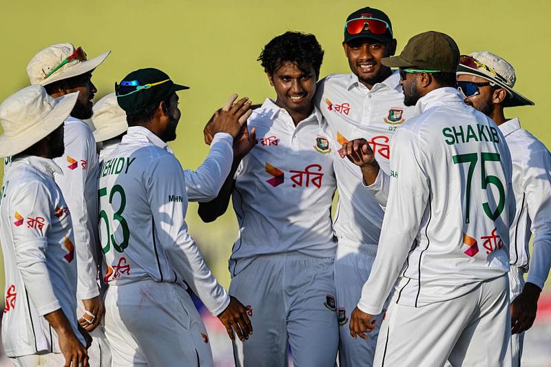 Bangladesh's players celebrate after the dismissal of Pakistan's Saim Ayub during the first day of the first Test cricket match between Pakistan and Bangladesh at the Rawalpindi Cricket Stadium in Rawalpindi on August 21, 2024